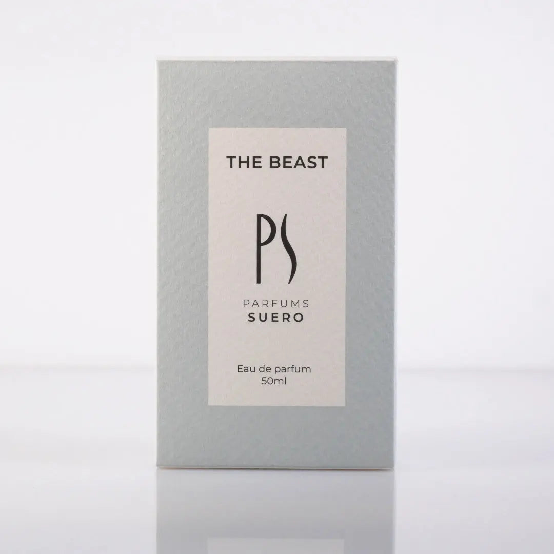 la boite du parfum The Beast de la marque PARFUM SUERO de face avec ses deux couleurs beige et bleu gris